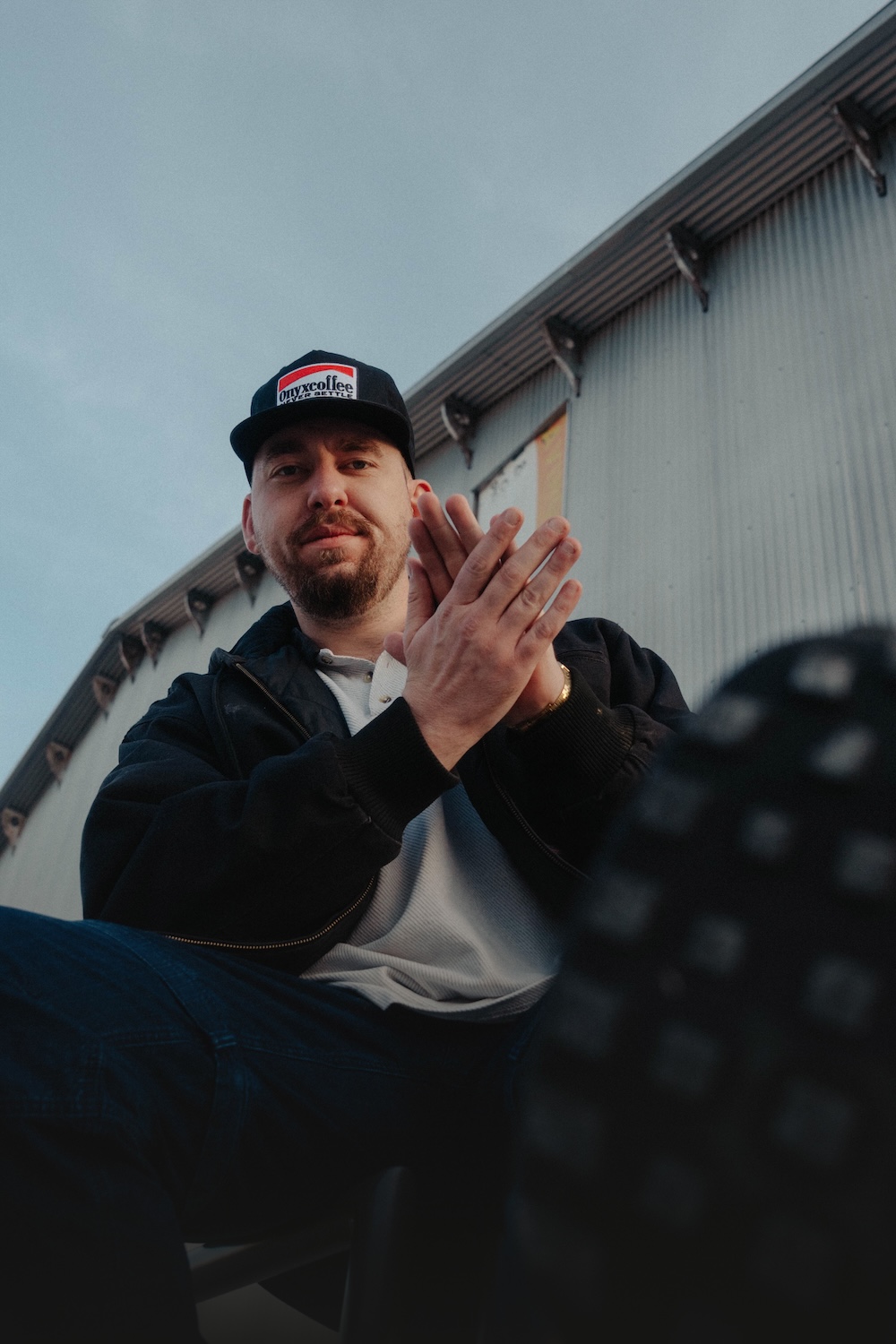 Picture behind 'NEW MERCH'